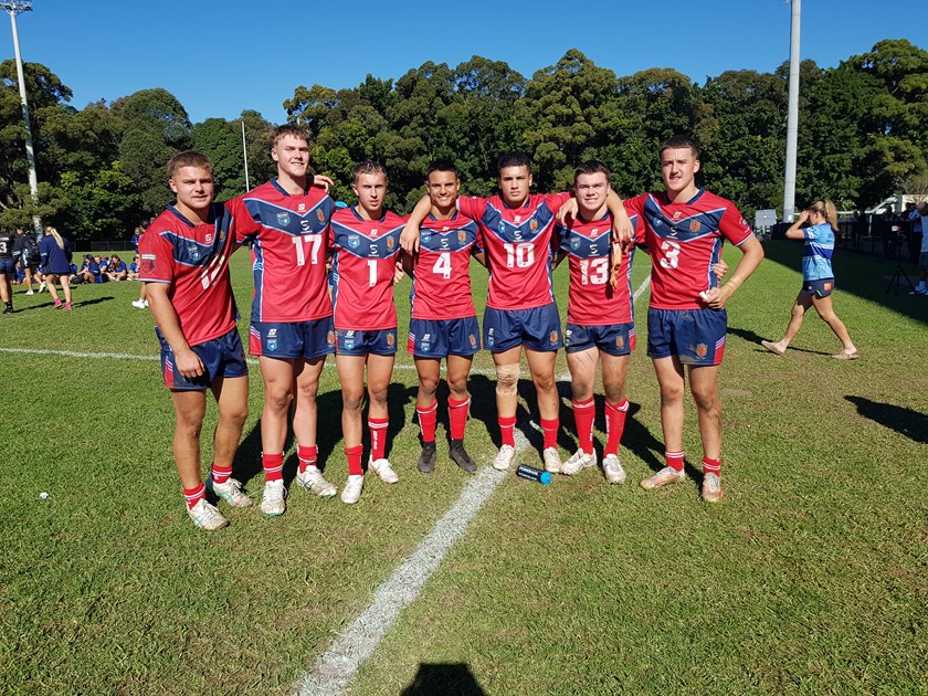 Sharks pair Nikora Williams (No.3) and Tom Dellow (No.13) pose with their Sydney Red teammates.